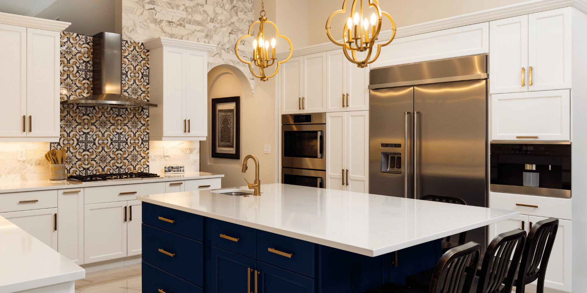 Stock Image of White and Gold Kitchen with Blue Island