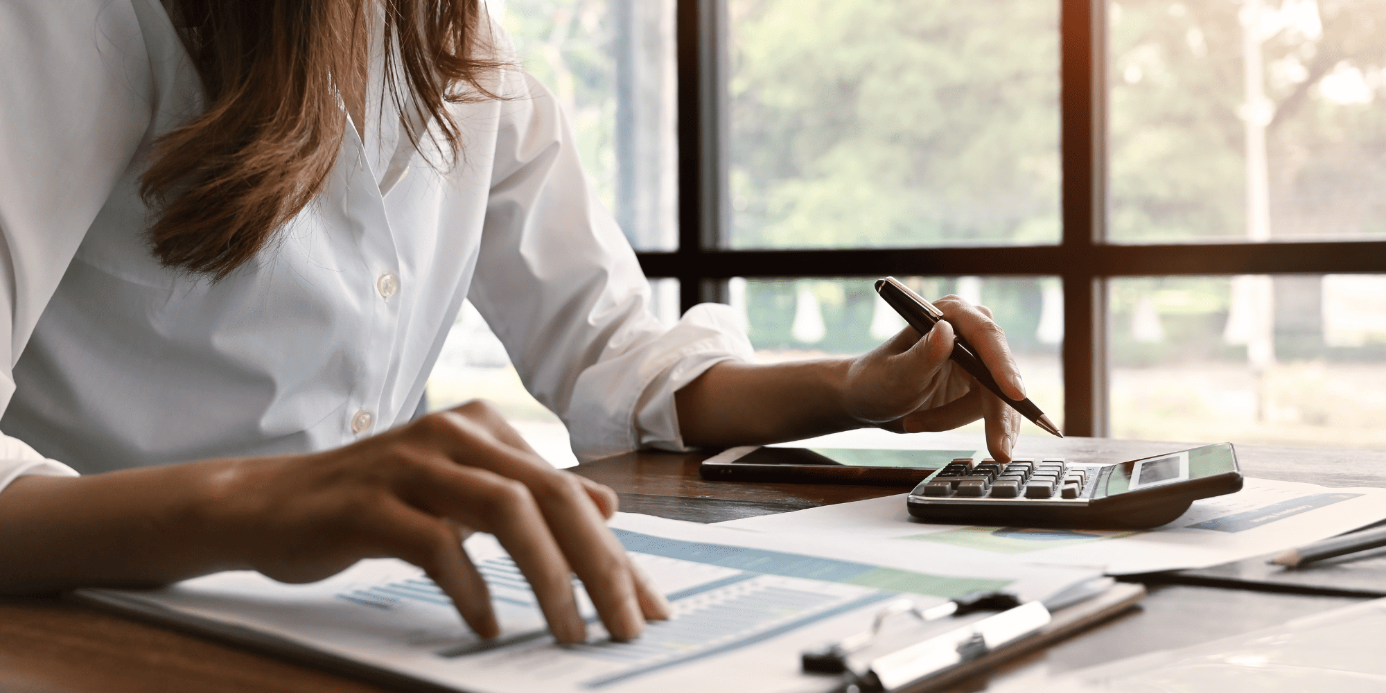 Stock Image of Woman Financing a Home Renovation at a Desk