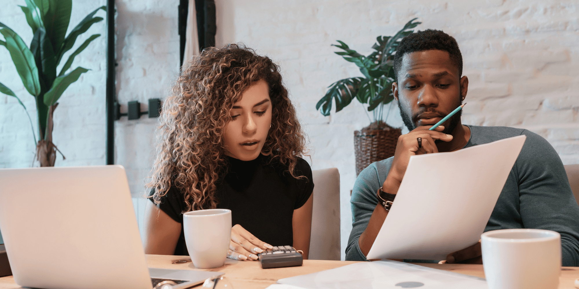 Stock Image of Couple Looking at Finances and Budgeting a Home Remodel