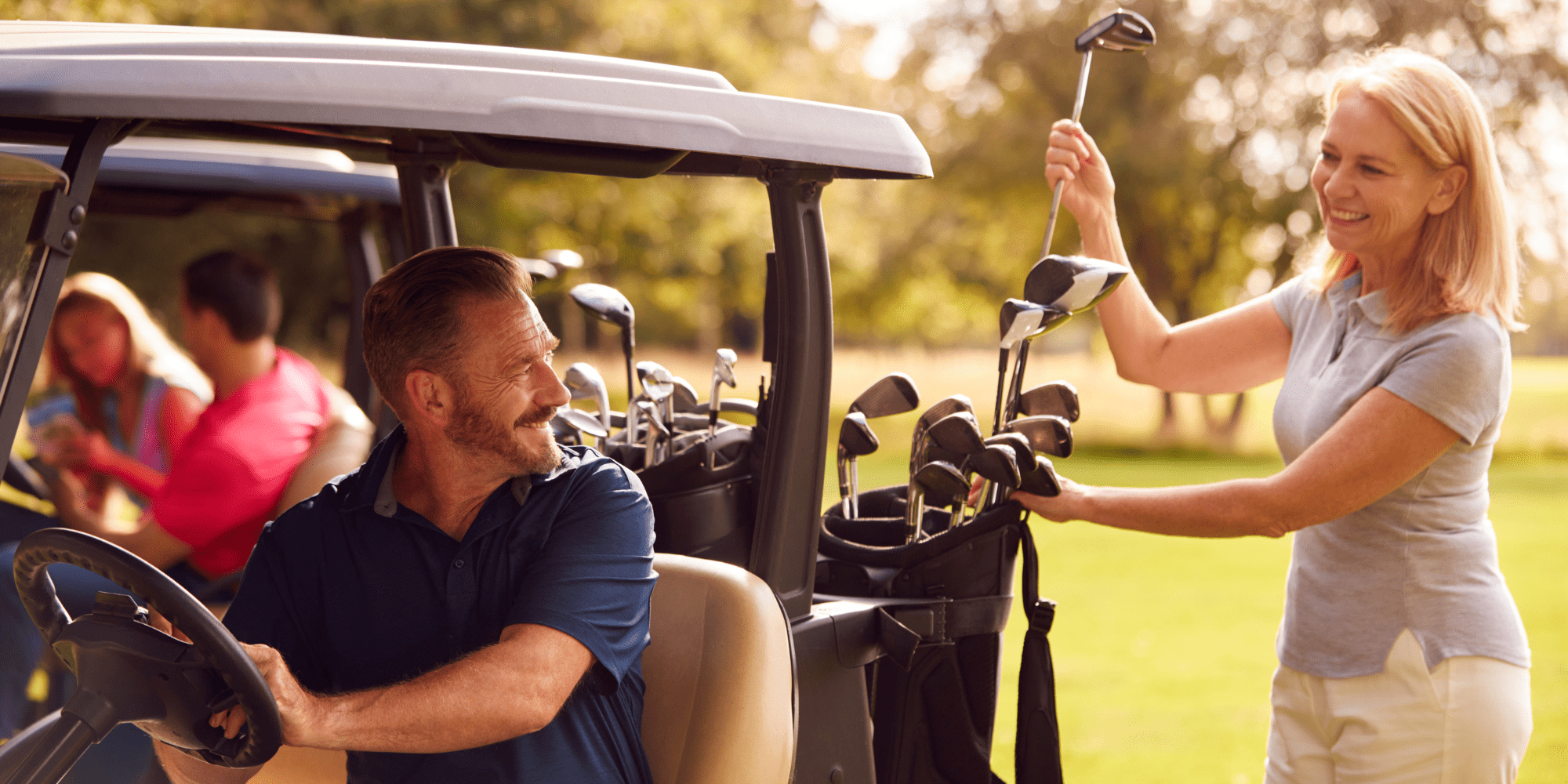 Stock Image of Couple in Golf Cart at New Jersey Country Club